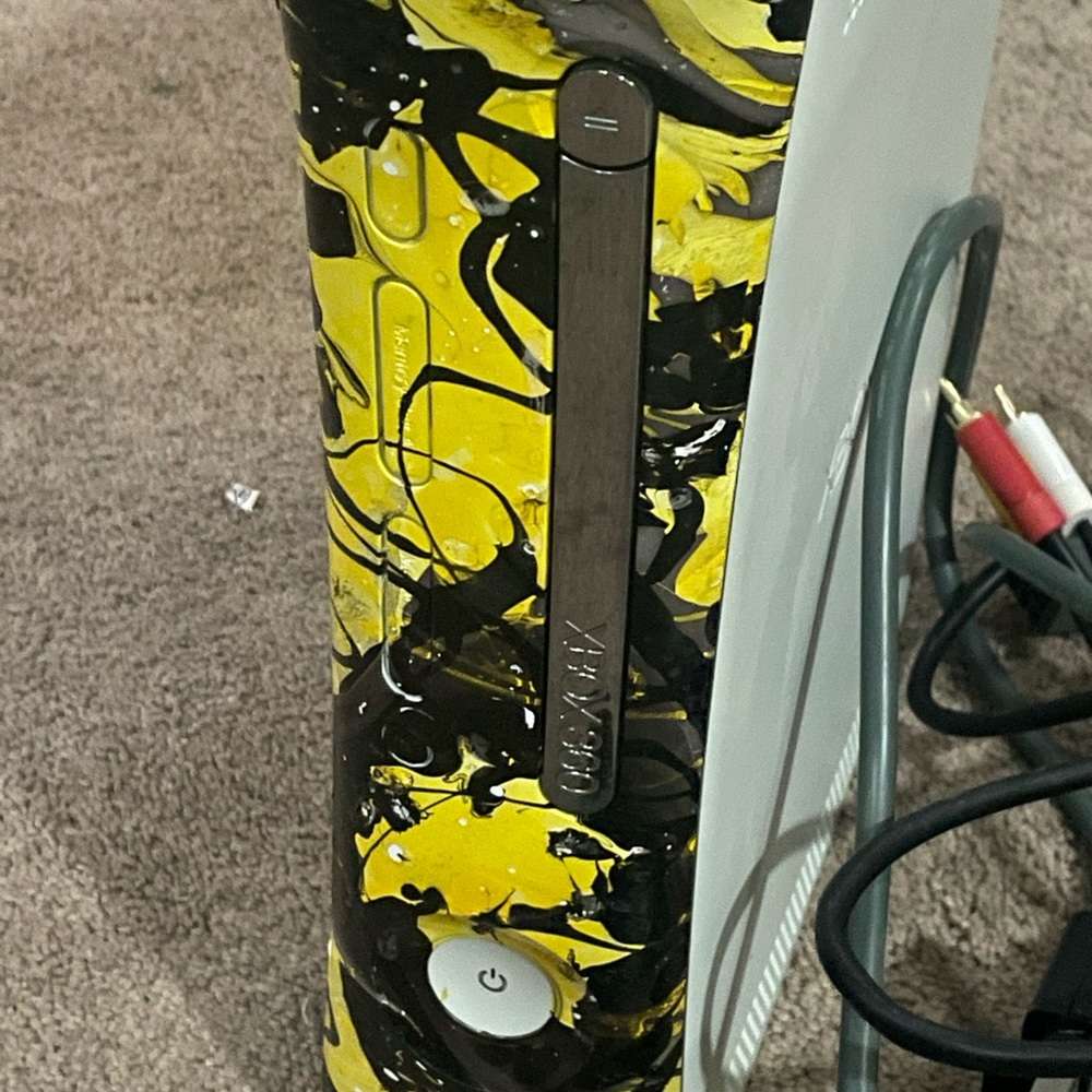 Xbox 360 with removable protective plasti-dipped front. 2 controllers.